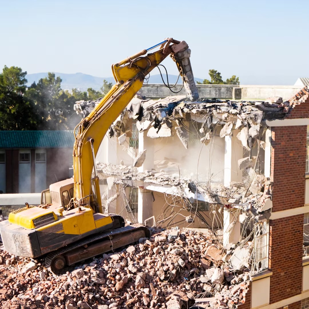 Controlled structural demolition in progress on a UK site